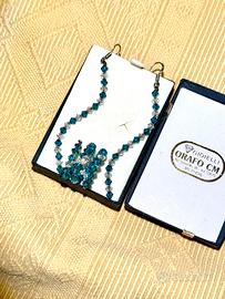 Completo orecchini e anello regolabile