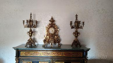 Trittico Orologio e due Candelabri in bronzo