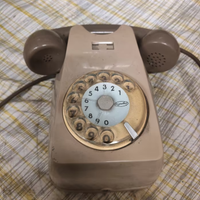 Telefono fisso a rotella da parete Sip vintage.