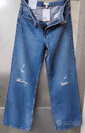 Jeans H&M,gamba ampia,vita alta,con strappi,nuovi.
