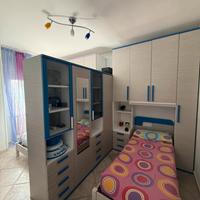 Cameretta doppia completa con armadio divisorio