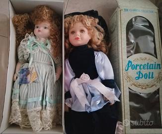 Tris bambole di porcellana