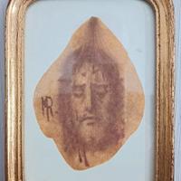 Quadretto religioso del volto di Gesù su foglia