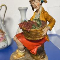 Statuina ragazza con cesto d’uva firmato B.Merli