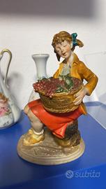 Statuina ragazza con cesto d’uva firmato B.Merli