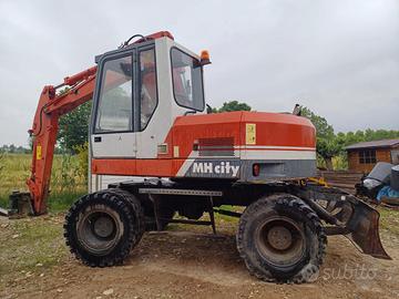 Escavatore gommato