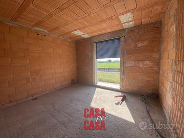 porzione di bifamiliare con giardino