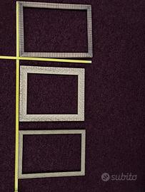 Tre cornici in legno intarsiato