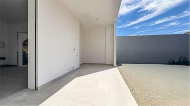 Trilocale di nuova costruzione con cortile e posto