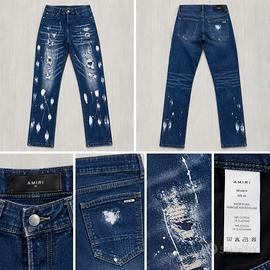 Jeans AMIRI distressed con schizzi di vernice