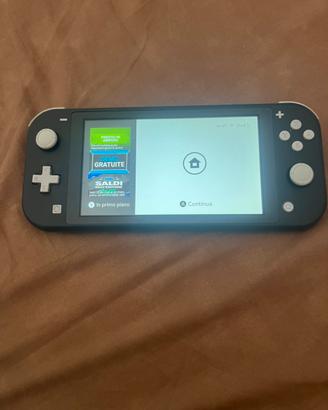 Nintendo Switch Lite Grigia + 4 Giochi + Accessori