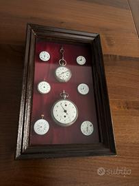 Cornice con orologi antichi