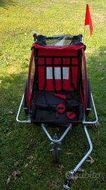 Rimorchio porta bimbi per bicicletta.