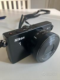 Nikon1 J4 fotocamera con obiettivo PD. 1375 scatti