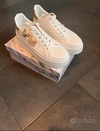 Sneakers oro con gancio topolino