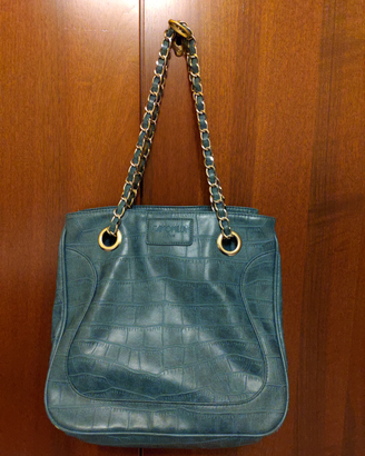Borsa verde petrolio pitonata