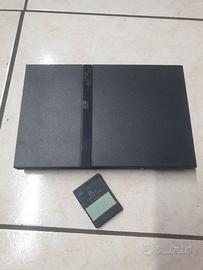 playstation 2 con accessori e video giochi.