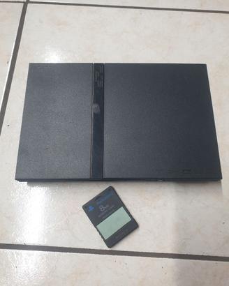 playstation 2 con accessori e video giochi.