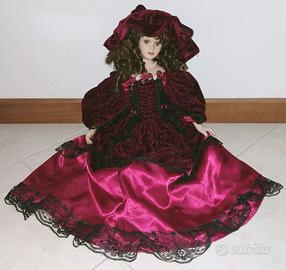 Bambola da collezione + abito di ricambio