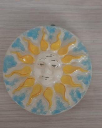Sole in ceramica da parete