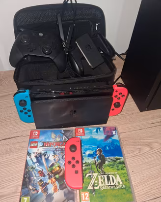 Nintendo Switch oled + giochi + 3 joycon + descriz