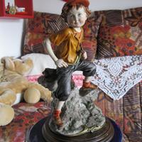 Ragazzo con fionda del maestro Giuseppe Armani