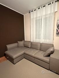 Divano letto con penisola contenitore