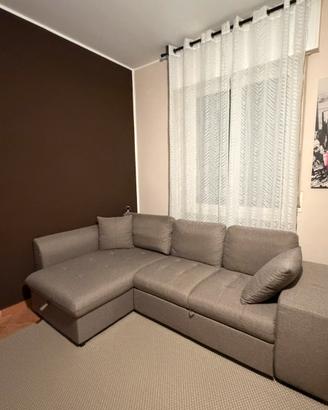 Divano letto con penisola contenitore