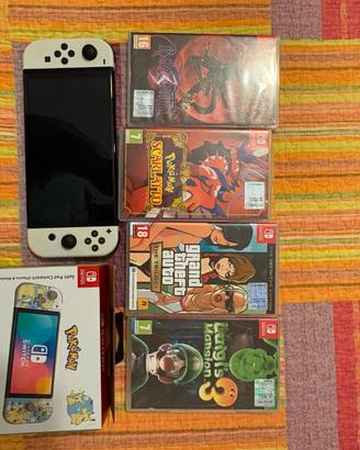 Nintendo switch oled completa +giochi+ 2 portaswic