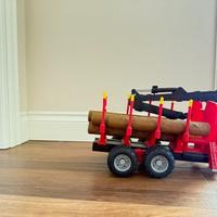 Bruder rimorchio scavatore con tronchi