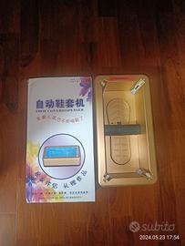 Dispenser automatico per copriscarpe