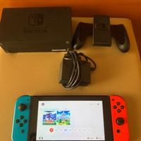 Nintendo Switch neon rossa e blu con accessori
