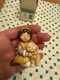 Bimba con gattino Thun