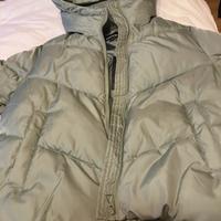 Piumino verde con cappuccio donna