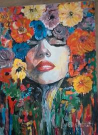 VOLTO DI DONNA TRA I FIORI