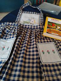 libro di cucina Artusi con grembiule