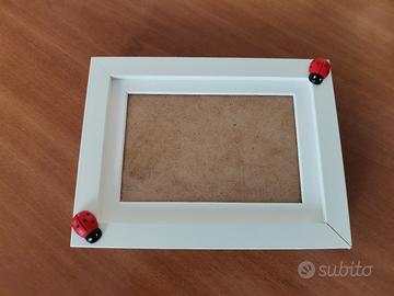 Carina cornice in legno bianco