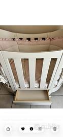 Culla ovale con cassetto  colore brige .