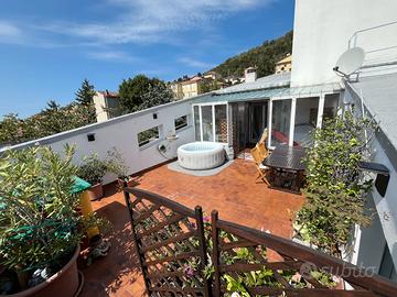 Attico con terrazza e box auto