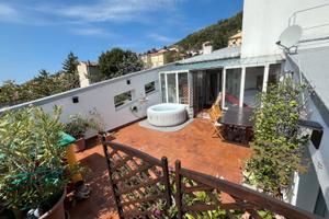 Attico con terrazza e box auto