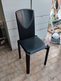 sedie usate , in legno, rivestite di cuoio