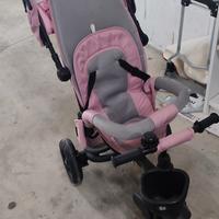 triciclo rosa con braccio