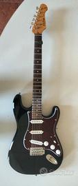 Chitarra elettrica ed amplificatore.