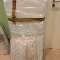 Lettino con sbarre e sponda