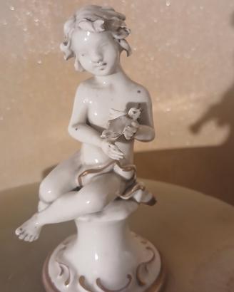 Statuina Putto con Uccellino in Porcellana 