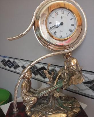 Orologio antico in argento placcato oro