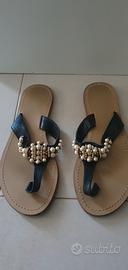 Ciabatte infradito in pelle nera e suola in cuoio