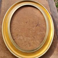 Cornice dorata ovale