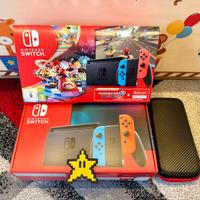 Nintendo switch con scatola e accessori.