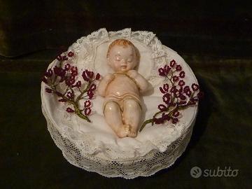 Bambinello con perline